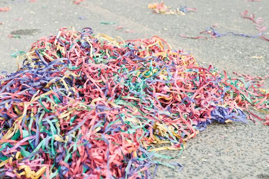 colorful confetti and streamers at the street after Carnival Parade