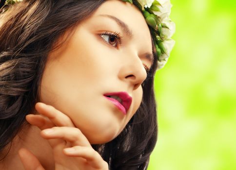 beauty woman with flower on green background