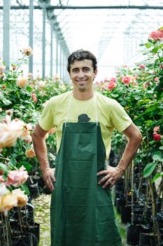 An image of a young worker in a greenhouse
