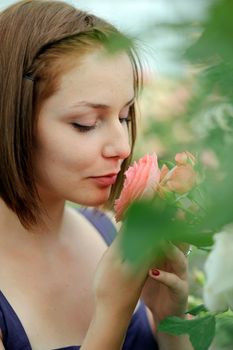 An image of a young beautiful woman in the garden