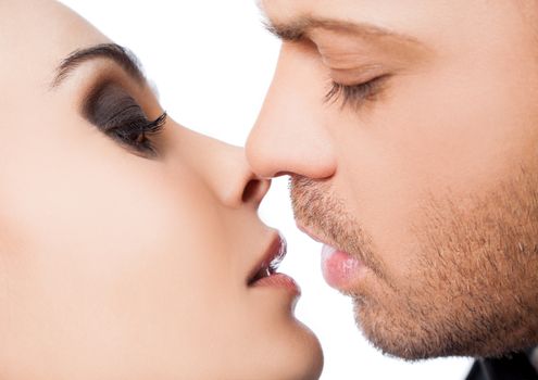Close-up of young couple faces about to kiss