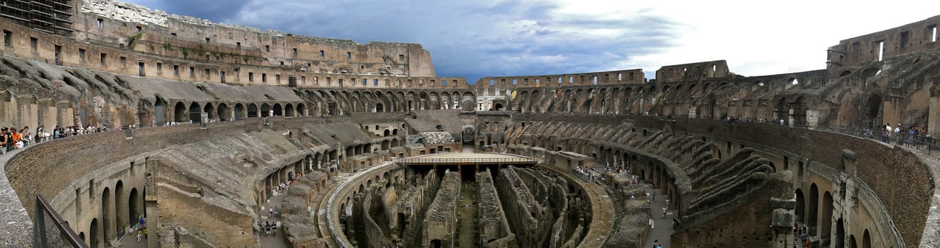 Panoramic view of the Colosseum with thinderstorm clouds