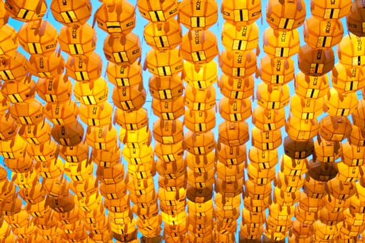 Yellow paper lanterns in buddhist temple during lotus festival for Buddha's brthday celebration