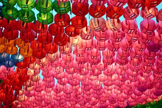 Red and pink paper lanterns in buddhist temple during lotus festival for Buddha's brthday celebration