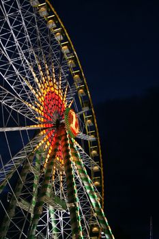 fun fair attraction ferris wheel at night