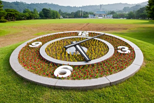 Flower clock on lawn background at Seoul National Cemetery