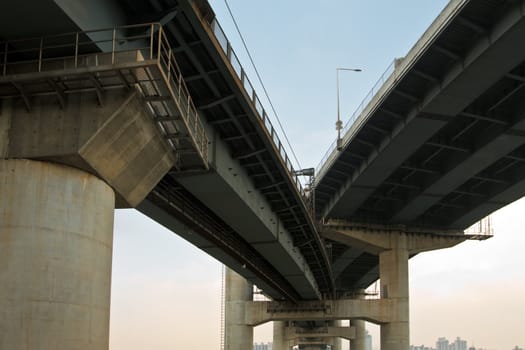 Elevated express way and subway line at evening time