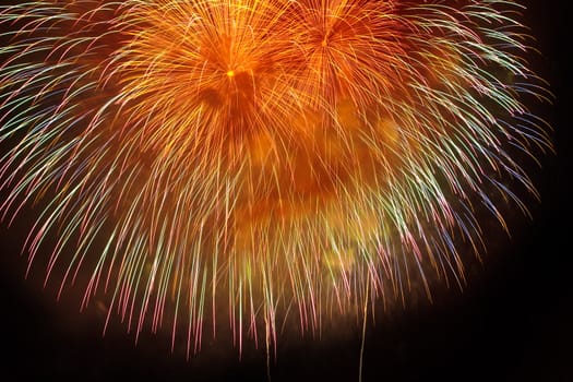 Colorful yellow and orange fireworks on  black sky