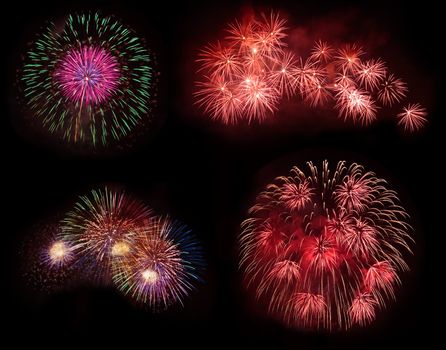 Four colorful fireworks isolated on black background