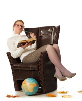 pretty female teacher sitting in armchair