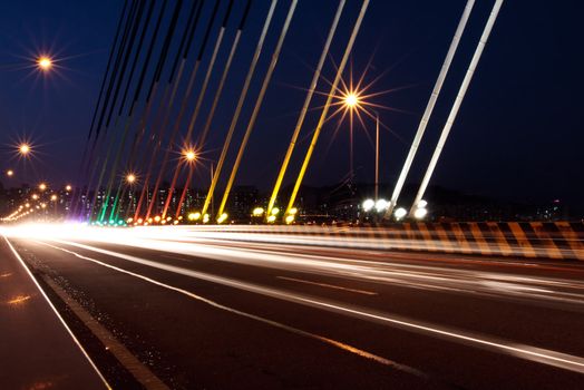 Traffic light traces on the cable-stayed bridge in night