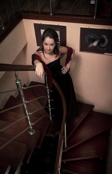 aristocratic lady on stairs in luxury house