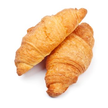 two fresh croissant isolated on white