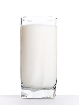 glass milk on a table, white background