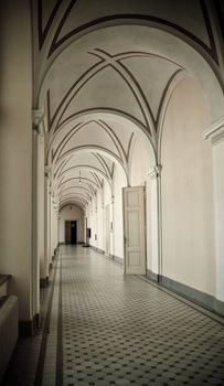 corridor in old vintage building with arch