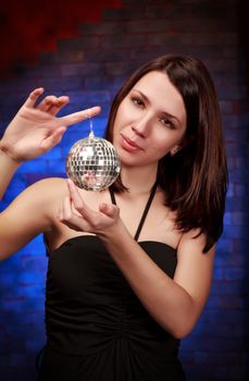 beautiful girl with decoration ball, blue background