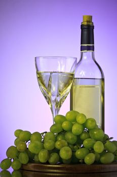 bottle and glass of wine, grape bunch, violet background