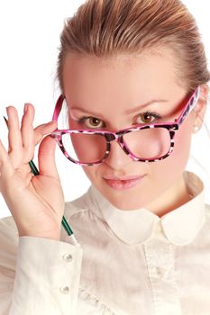 pretty teacher in funny eyeglasses with pen