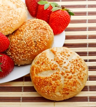 breakfast with sesame buns and strawberry, top view