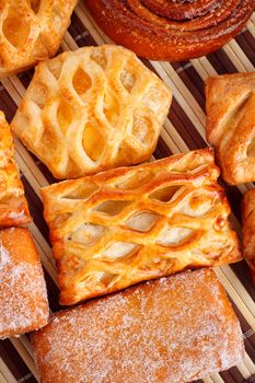 different types of biscuits on bamboo napkin, top view