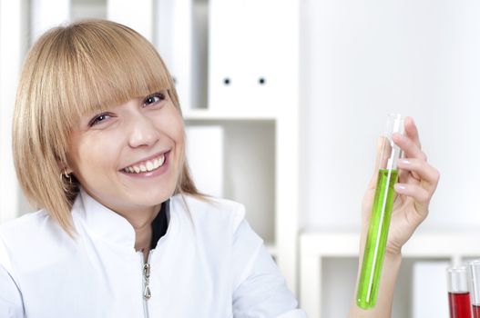 chemist working in the laboratory, mix liquid