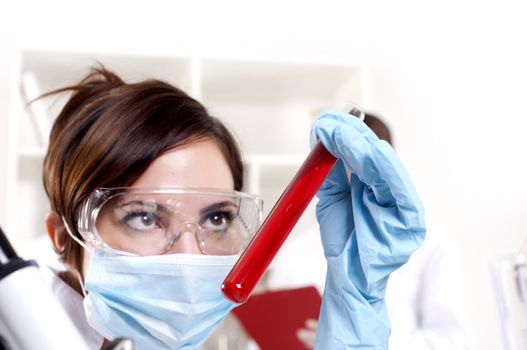 chemist working in the laboratory, mix liquid