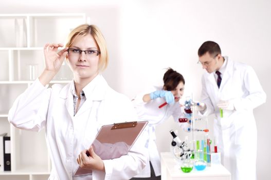 portrait of doctor, holds a tablet in the office