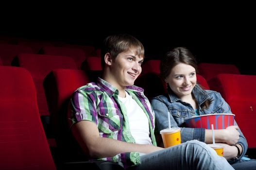 couple in a movie theater, watching a movie