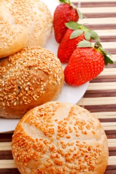 breakfast with sesame buns and strawberry, top view