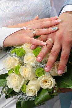 Bridal Groom Wedding Hands of Couple on Bouquet