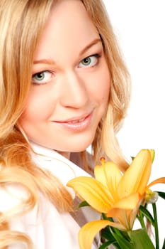 beautiful young woman with lily flower, close-up portrait