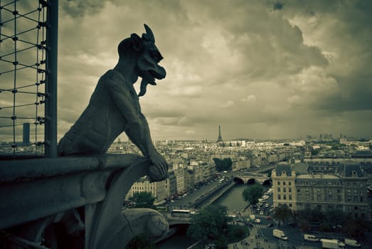 View on Paris from above. sculpture on left, Eiffel tower on the right in background