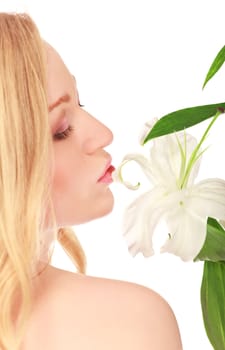 beautiful young woman kissing lily flower, close-up portrait