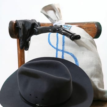 An image of a gun and a bag on a chair