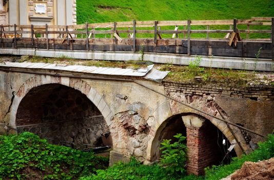 old broken stone bridge at summer day