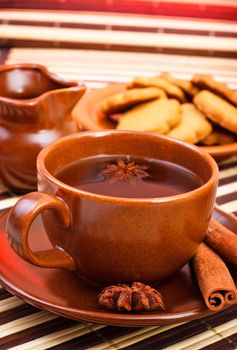 winter tea with cinnamon and star anise on bamboo napkin