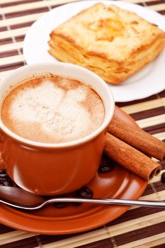 coffee cup and pie on bamboo napkin