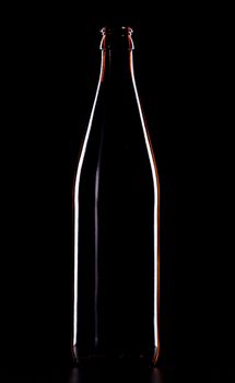 empty beer bottle isolated on black background