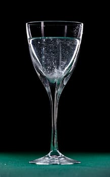 mineral water glass isolated on black background