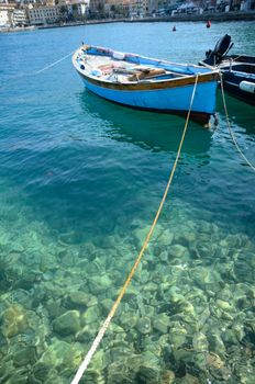 The wooden rowing and sailing boat in Tuscany