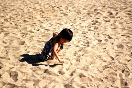 HONG KONG - JUL 3, A young and cute Chinese girl playing sand n Hong Kong on 3 July, 2010.