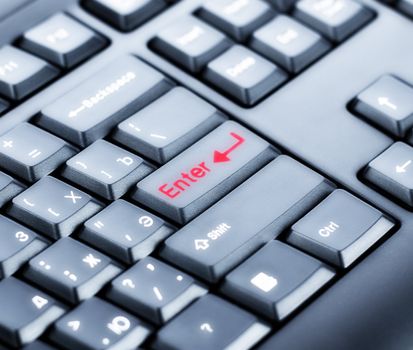 part of black keyboard with red ENTER key