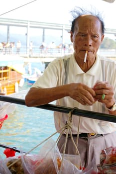 HONG KONG - NOV 17, A Chinese fisherman is selling his fishes in Sai Kung, Hong Kong on 17 November, 2009. 