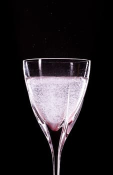 mineral water glass isolated on black background