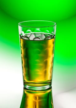 fresh tasty apple juice on the abstract green background