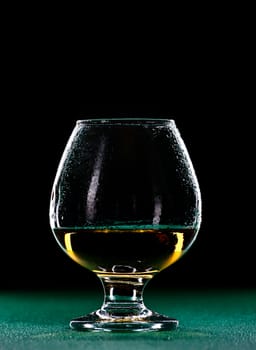 elegant whiskey glass isolated on black background