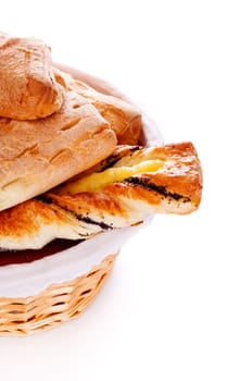 basket filled with buns isolated on white background