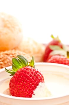 fresh strawberry in sour cream, close up