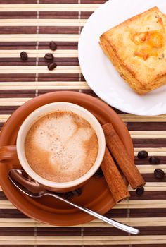 coffee cup and pie on bamboo napkin