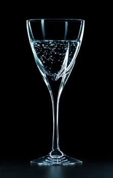 mineral water glass isolated on black background